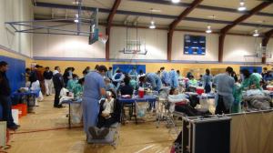 The gym at Cesar Chavez Community Center was busy with people receiving free dental treatments